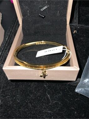 Coach Gold-Tone Textured Charm Bangle Bracelet
